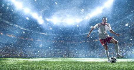 Fototapeta na wymiar Soccer player kicks the ball on the soccer stadium. He wear unbranded sports clothes. Stadium and crowd made in 3D.