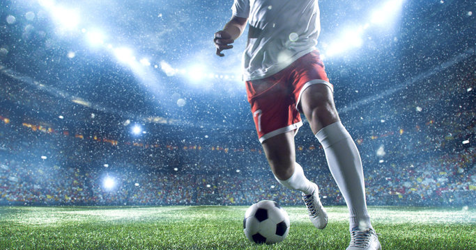 Fototapeta Soccer player kicks the ball on the soccer stadium. He wear unbranded sports clothes. Stadium and crowd made in 3D.