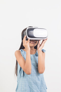 little girl  playing video games virtual reality glasses