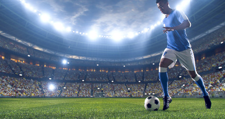 Soccer player kicks the ball on the soccer stadium. He wear unbranded sports clothes. Stadium and crowd made in 3D. - Powered by Adobe