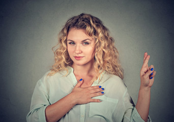 A liar young woman making a promise