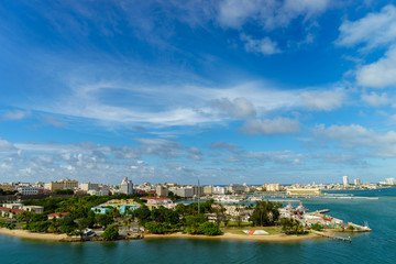 Fototapeta na wymiar Scenic view of historic colorful Puerto Rico city in distance from the sea