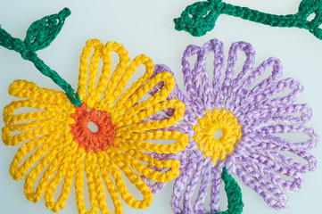Handmade wool knitted flower colorful texture background