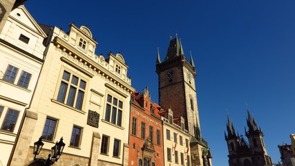 Prague Astronomical Clock and Tyn Church in Old Town Square with blue sky
