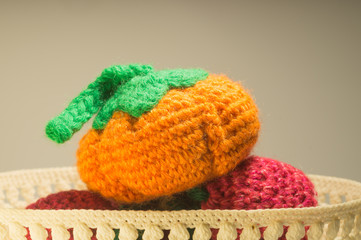 Handmade knitted vase with pumpkin isolated on white