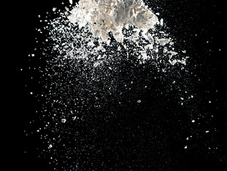 white powder explosion isolated on black background for graphic resources