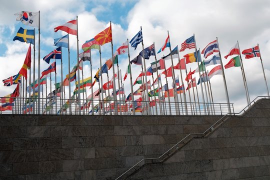 Flags from different countries around the world fluttering
