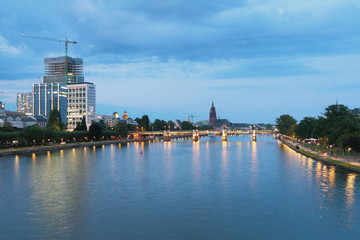 River, bridge and city in evening. Frankfurt am Main, Germany