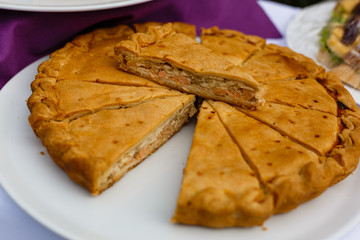 meat pie sliced on a white plate