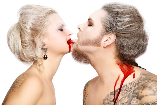 Pierced tattooed man and woman with old-fashioned make-up and hairstyle
