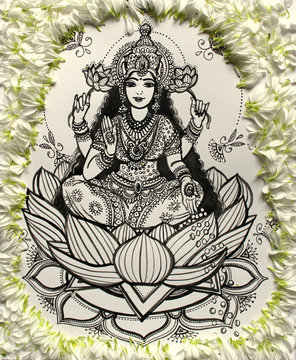 goddess Lakshmi, drawing with ink of the goddess Lakshmi on a lotus flower, India, Diwali holiday. White flower petals surround the image of Lakshmi 