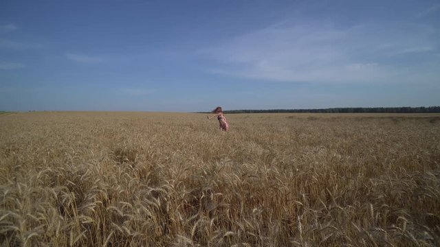 Dancer Hip Hop. Sexy young woman in American bikini dancing in wheat field