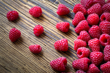 Raspberries on old wooden table