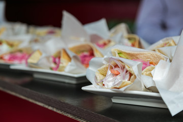 Obraz na płótnie Canvas Club sandwiches on table outdoor party food
