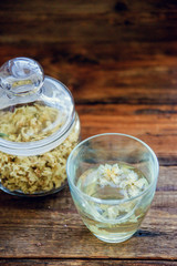 jasmine tea in a glass cup on the background of the old invoice board