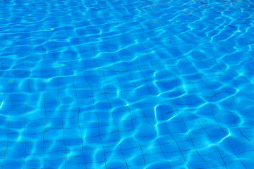 Fototapeta na wymiar Blue water on the surface of the pool pattern background.