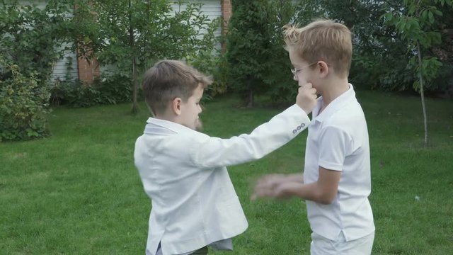 Little boys plays in rock-paper-scissors game