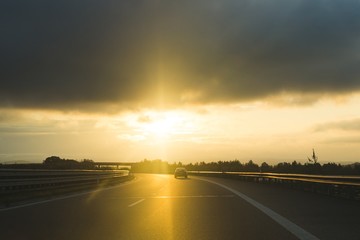 Fototapeta premium Misty morning sunrise on the road. Slovakia