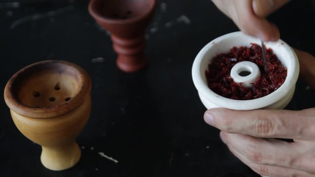The process of cooking shisha, hookah bowl