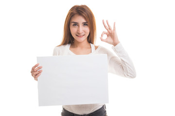 Young Asian woman show OK with white blank sign.