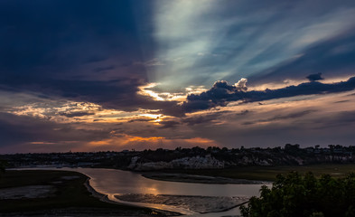 storm cloud sunset over the back bay in Newport Beach California