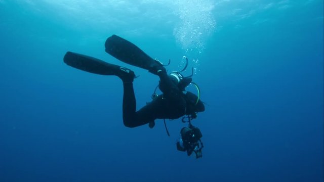 Scuba diver in open ocean, POV