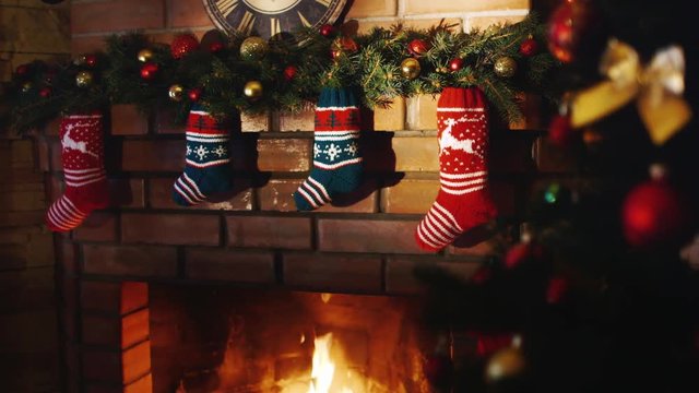 Above the fireplace hangs a burning socks for gifts for Christmas