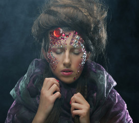 Portrait of young woman with creative visage, halloween picture.