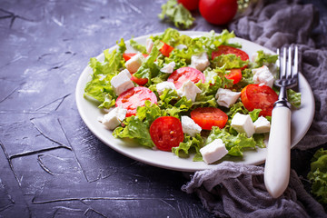 Healthy salad with tomato and feta cheese