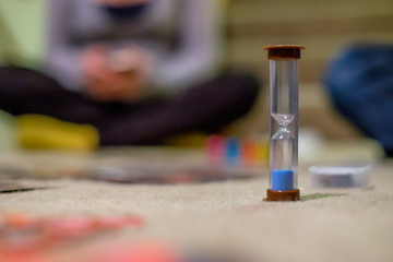 hourglass with people in background