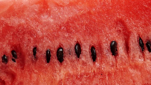 Closeup of fresh red watermelon fruit as background. Healthy food organic nutrition. Dolly slider shot 4K ProRes HQ codec