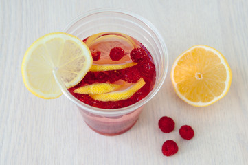 Summer cooling drink made of lemon and raspberry