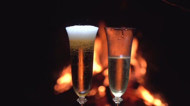 still life with champagne on the background of fire
