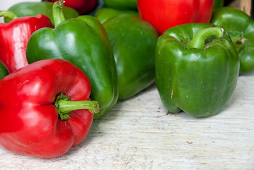 whole red and green peppers at the food market