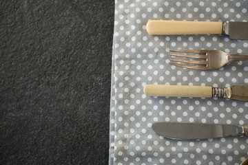 High angle view of cutlery on napkin