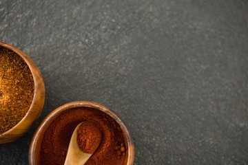 Overhead view of grounded food in wooden bowls