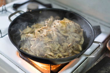 Roasted Salty Chicken fried In the pan On the gas stove