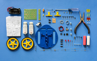 Aerial view of electronics tools equipments on blue background
