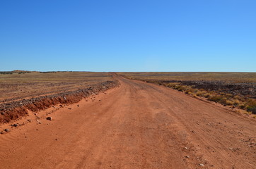 Fototapeta na wymiar Desert road with blue sky