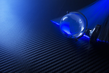 glass global world with fiber optic light in network concept