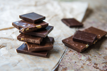 Dark chocolate stack with hazelnuts. Sweet dessert