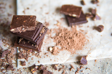 Dark chocolate stack with hazelnuts, selective focus