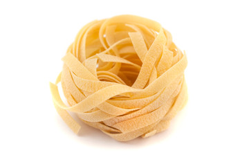 Italian pasta fettuccine nest isolated on white background