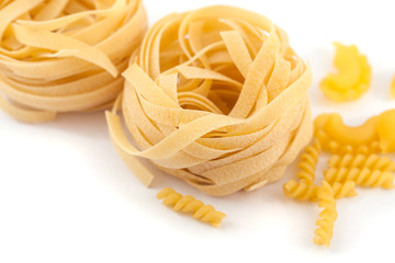 Italian pasta fettuccine nest isolated on white background