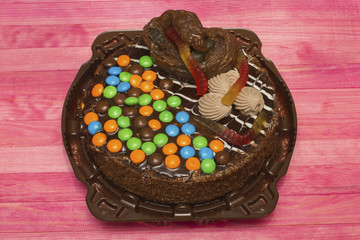 joke poop cake on pink wood