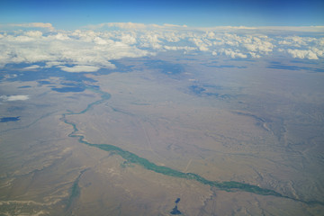 Fototapeta premium Aerial view of Badwater Creek, view from window seat in an airplane