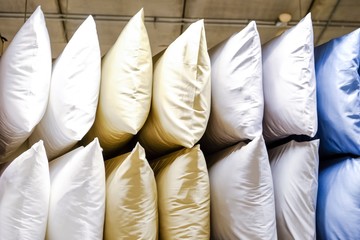 Colorful pillows are stored on the shelves.