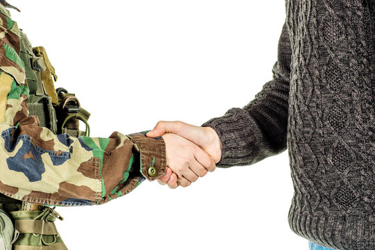 Soldier shaking hands with civil man