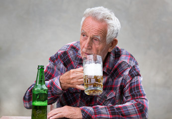 Old man drinking beer