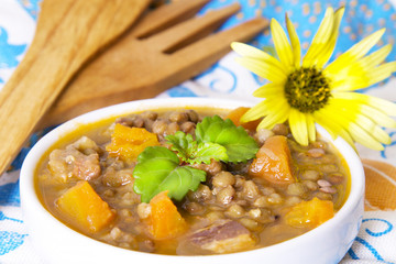 tasty braised lentils with wooden cutlery